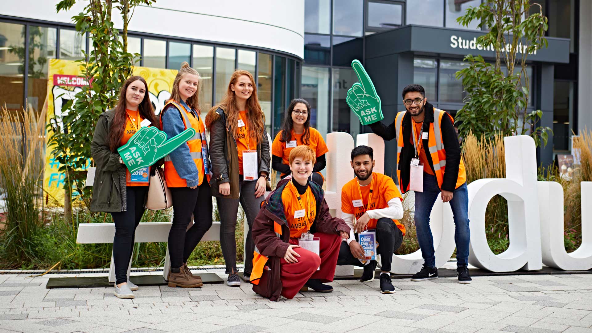 Picture of Student Ambassadors posing next to the Hud Uni hashtag.