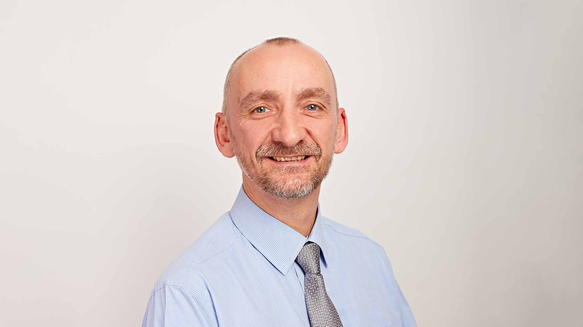 A headshot of Andrew Crampton