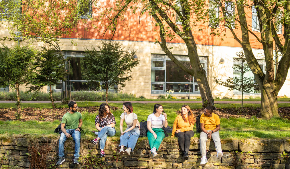 International Students Sitting Outside by the Canal