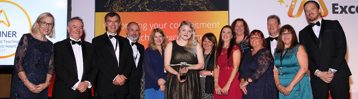 Huddersfield staff collecting the Global Teaching award on the night