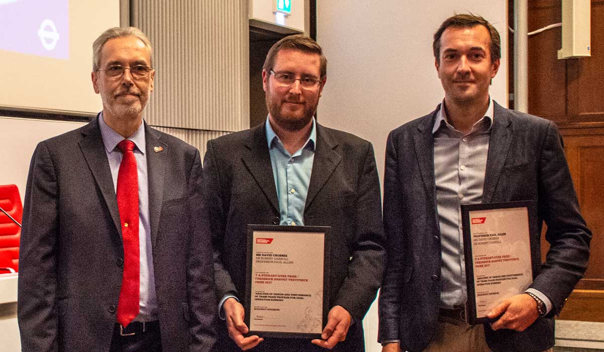 Pictured receiving their award David Crosbee (centre) and Professor Paul Allen (right)