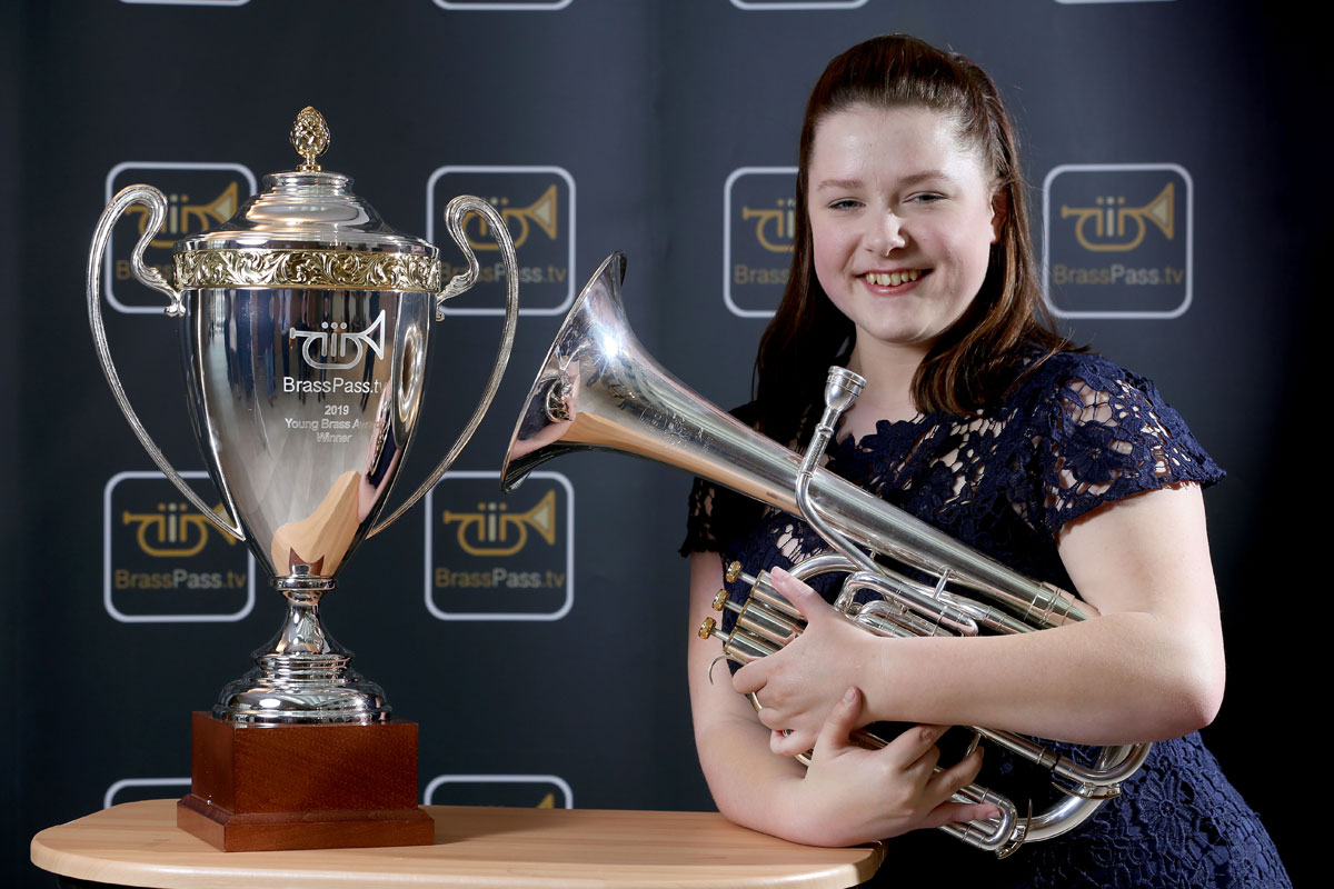 Tenor horn player Siobhan Bates with the cup for winning the BrassPass.tv Young Brass Award 2019