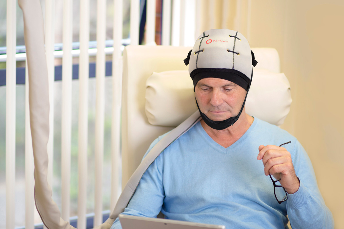 patient wearing a paxman cooling cap