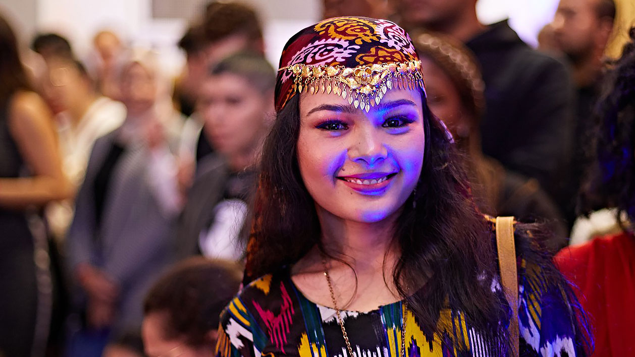 A student in traditional costume at the 10th global food and culture festival