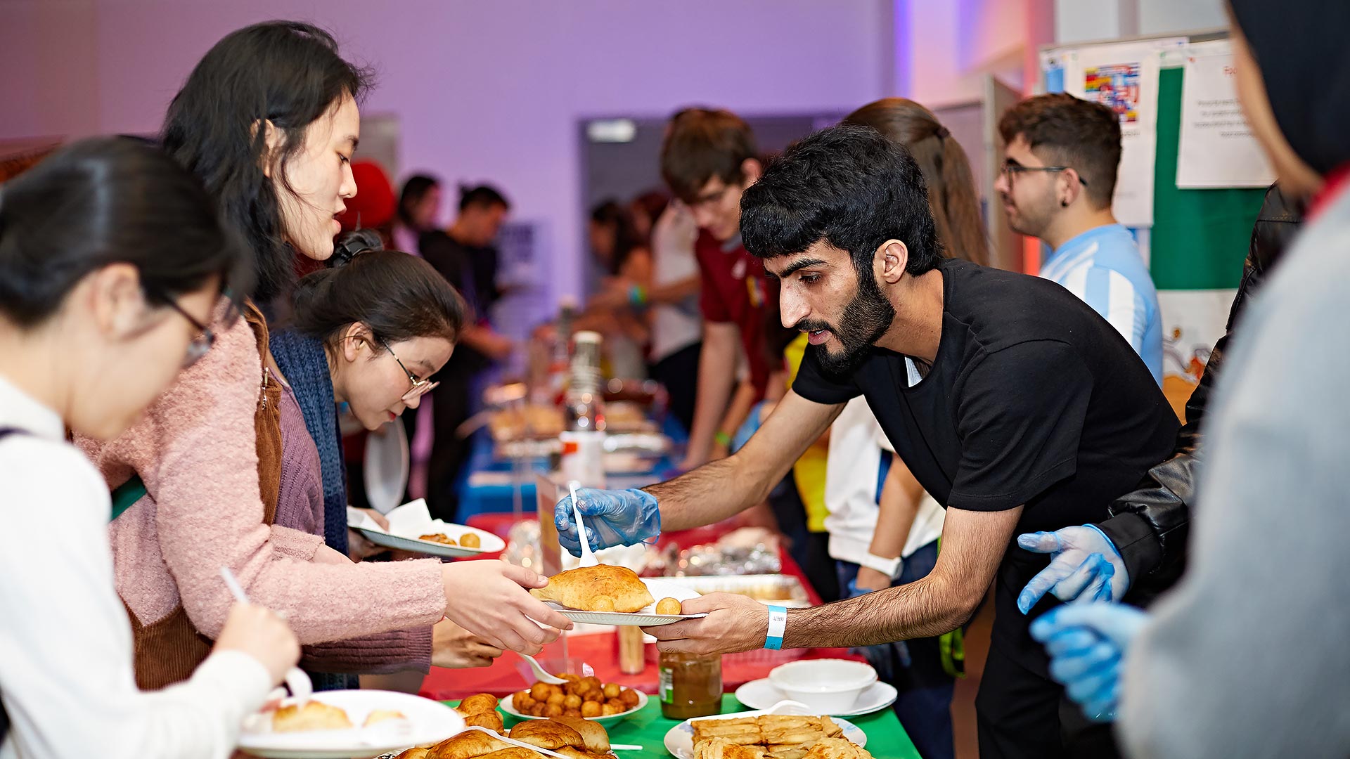 Students enjoying the food at the 10th global food and culture festival