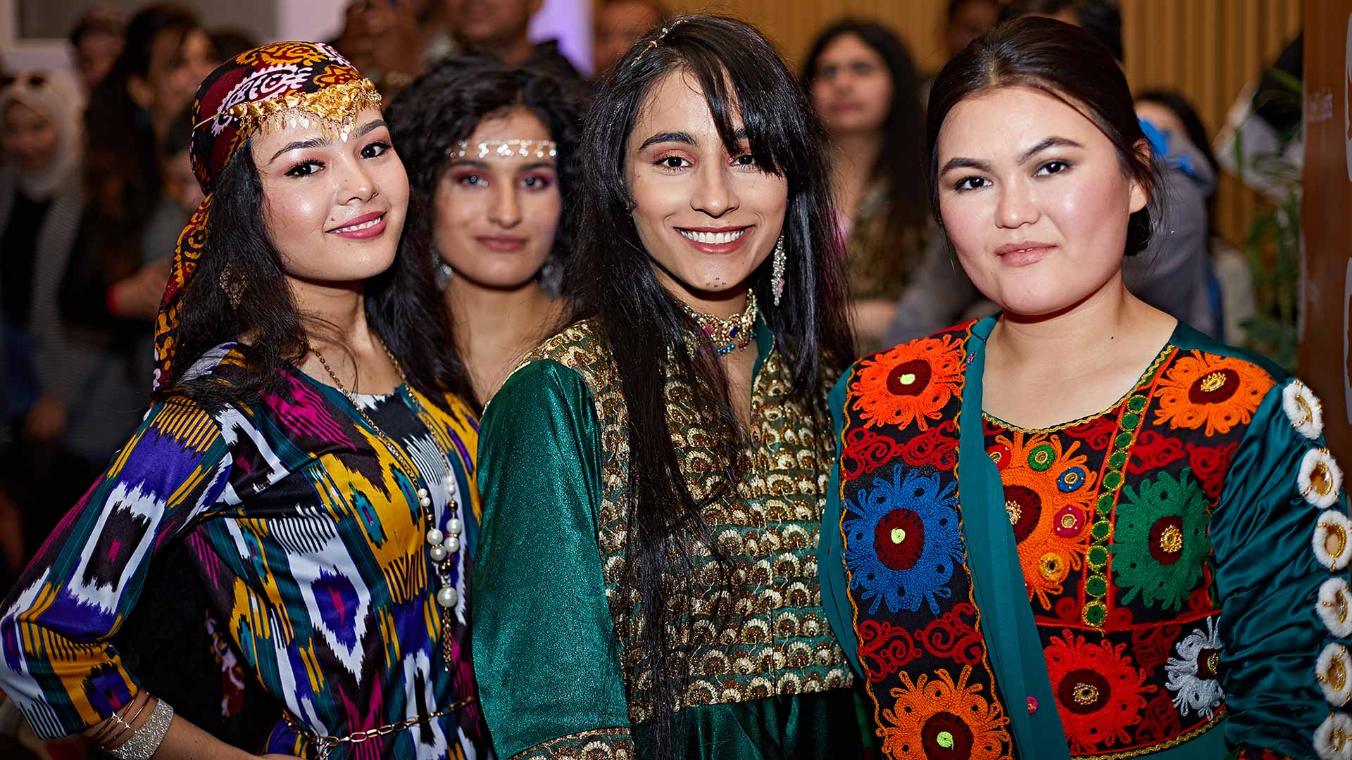 four girls in traditional costumes at the 10th global food and culture festival