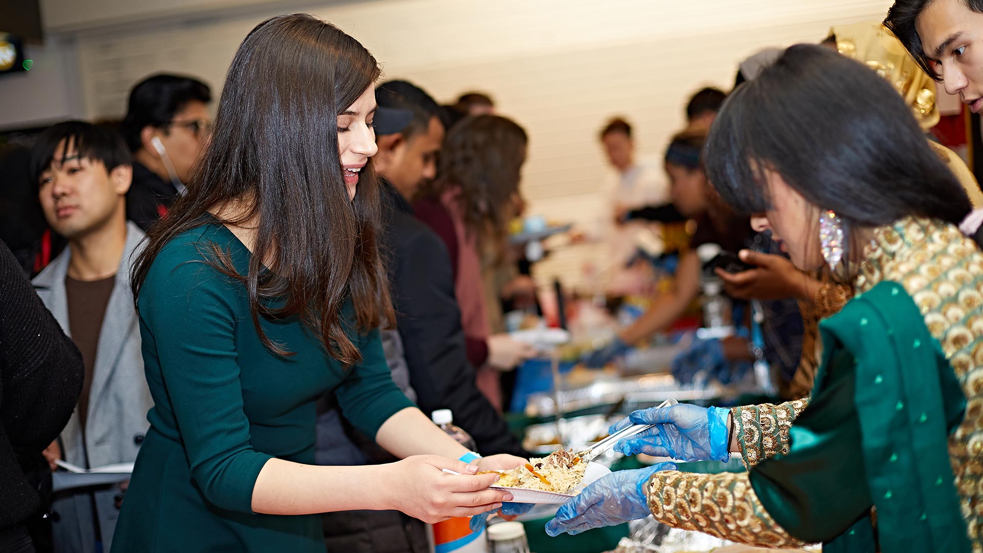 Students enjoying the food at the 10th global food and culture festival