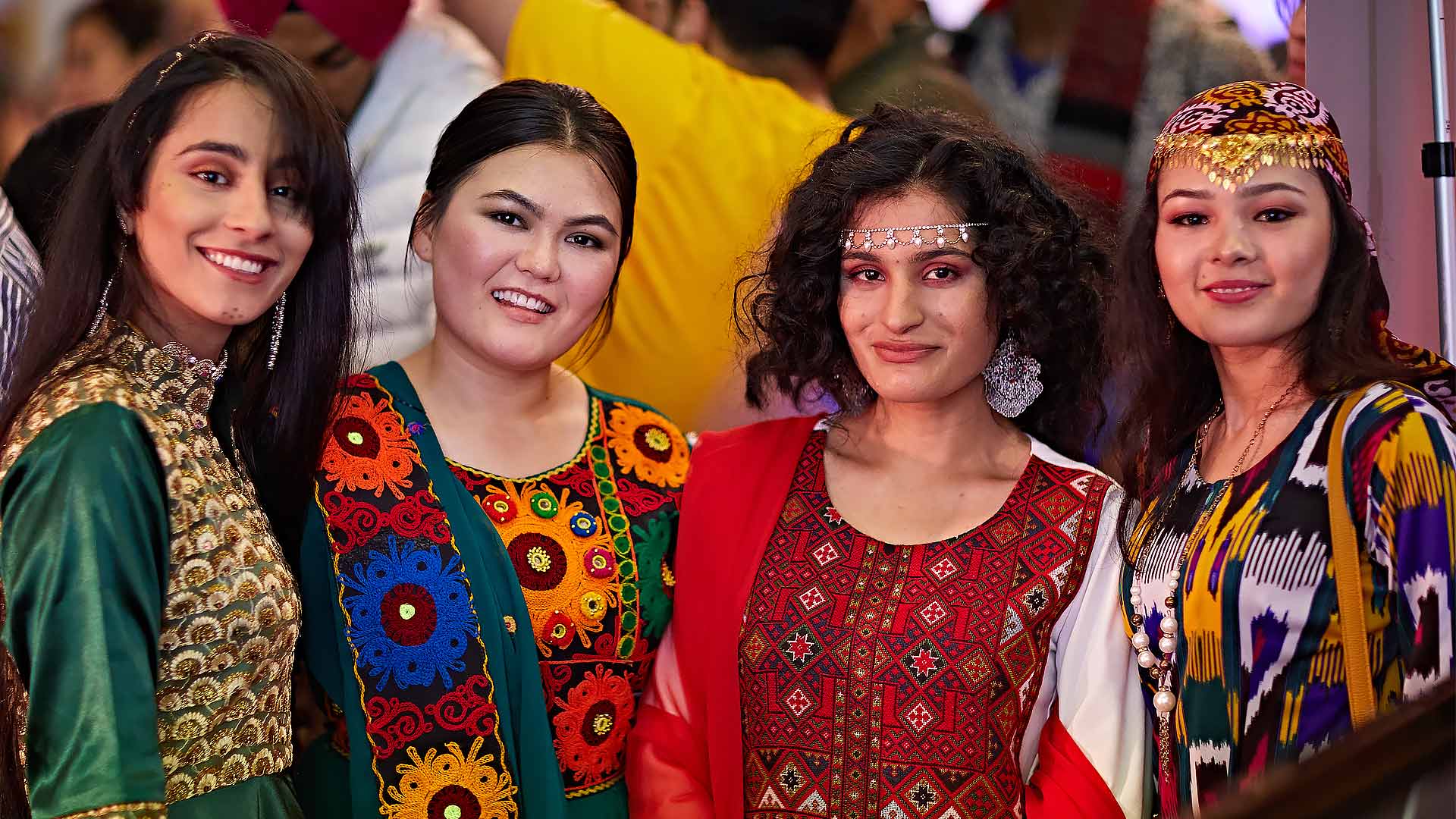 Four students in traditional costume at the 10th Global food and culture festival