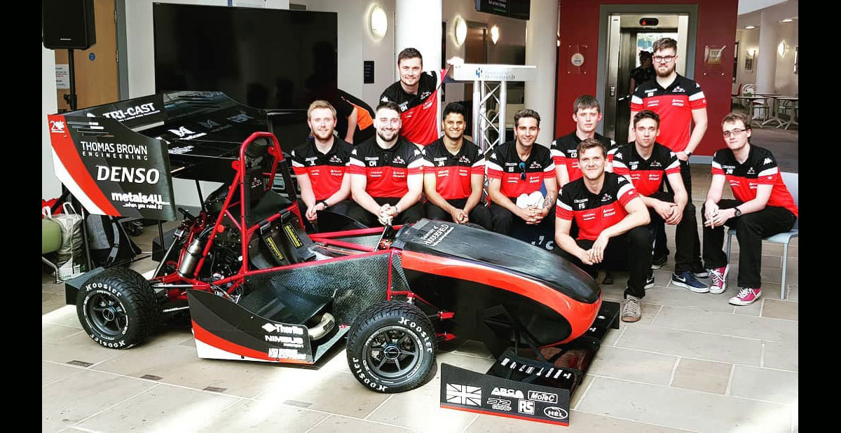 Team HARE members with the car