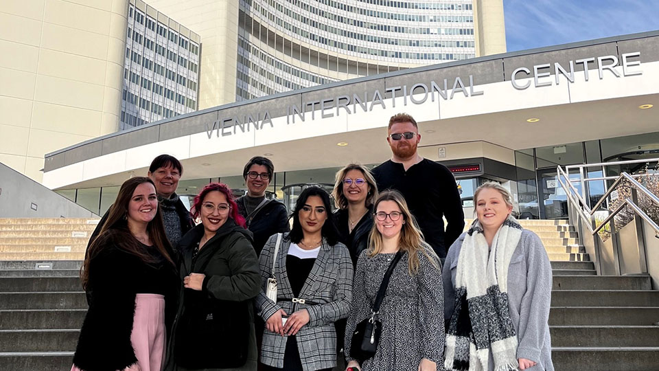 Huddersfield students on the steps at the UN in Vienna