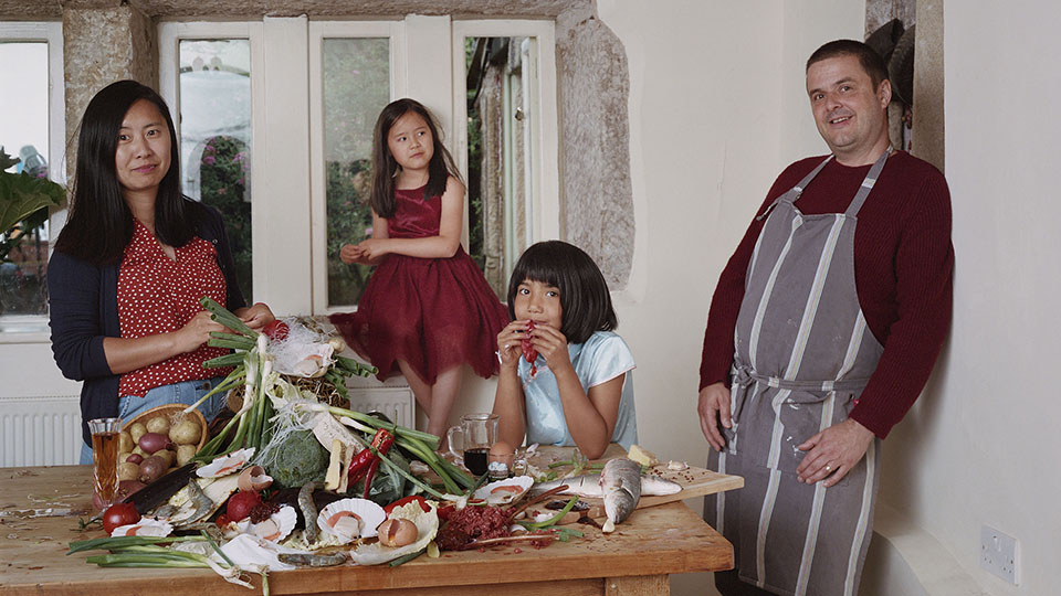 A family standing in their house