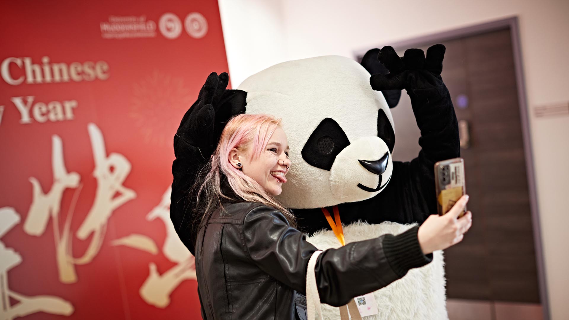 Panda with a female student, not a real panda