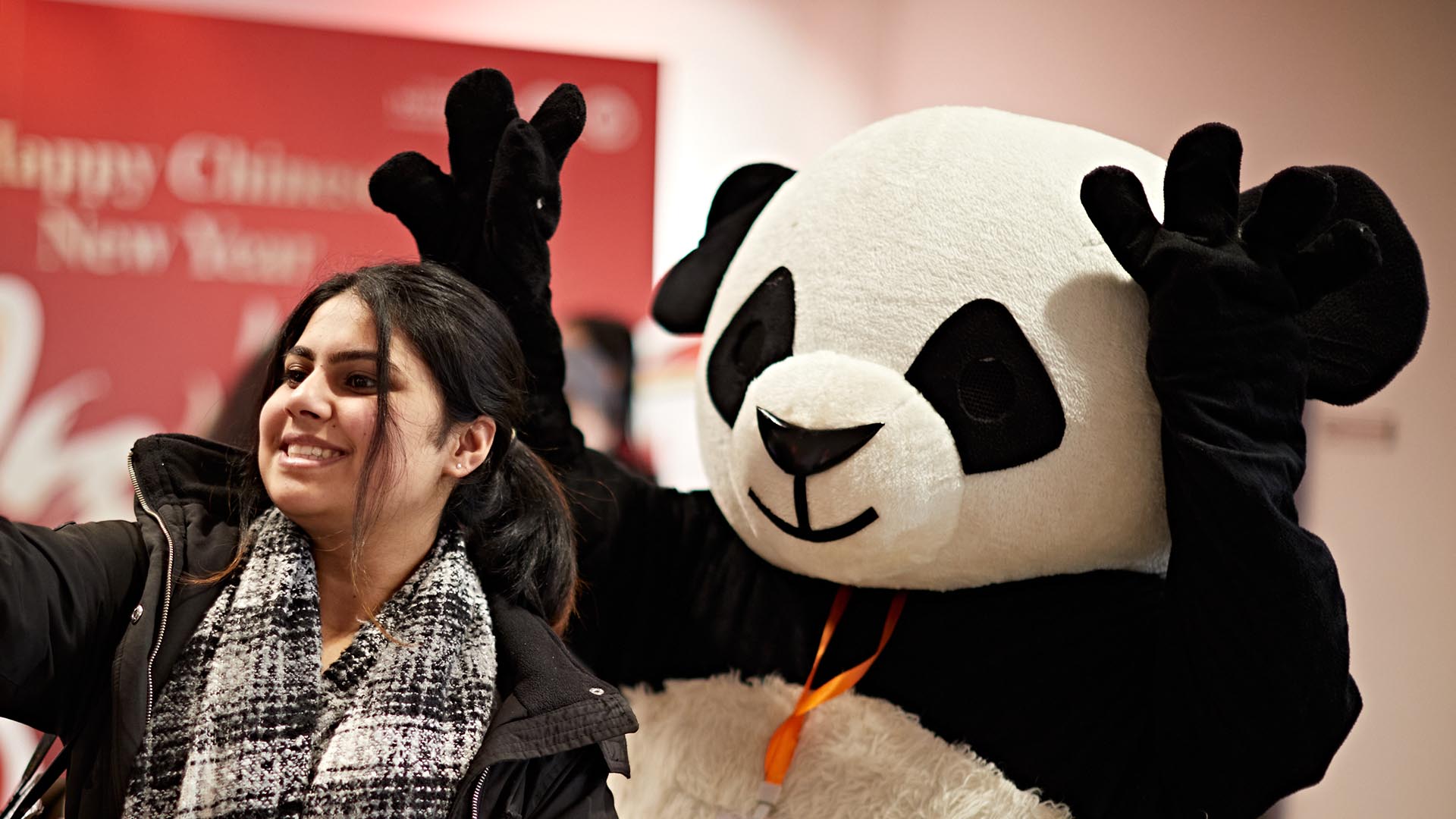 A panda with a student