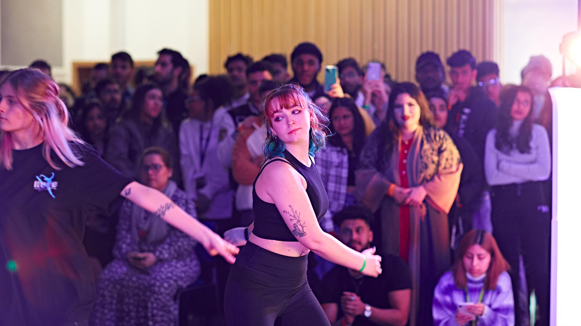 Female students dance at Global Week