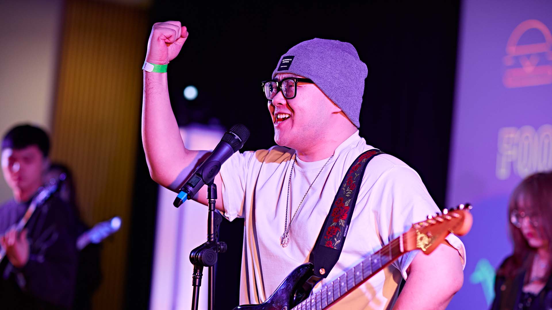 A student plays an electric guitar