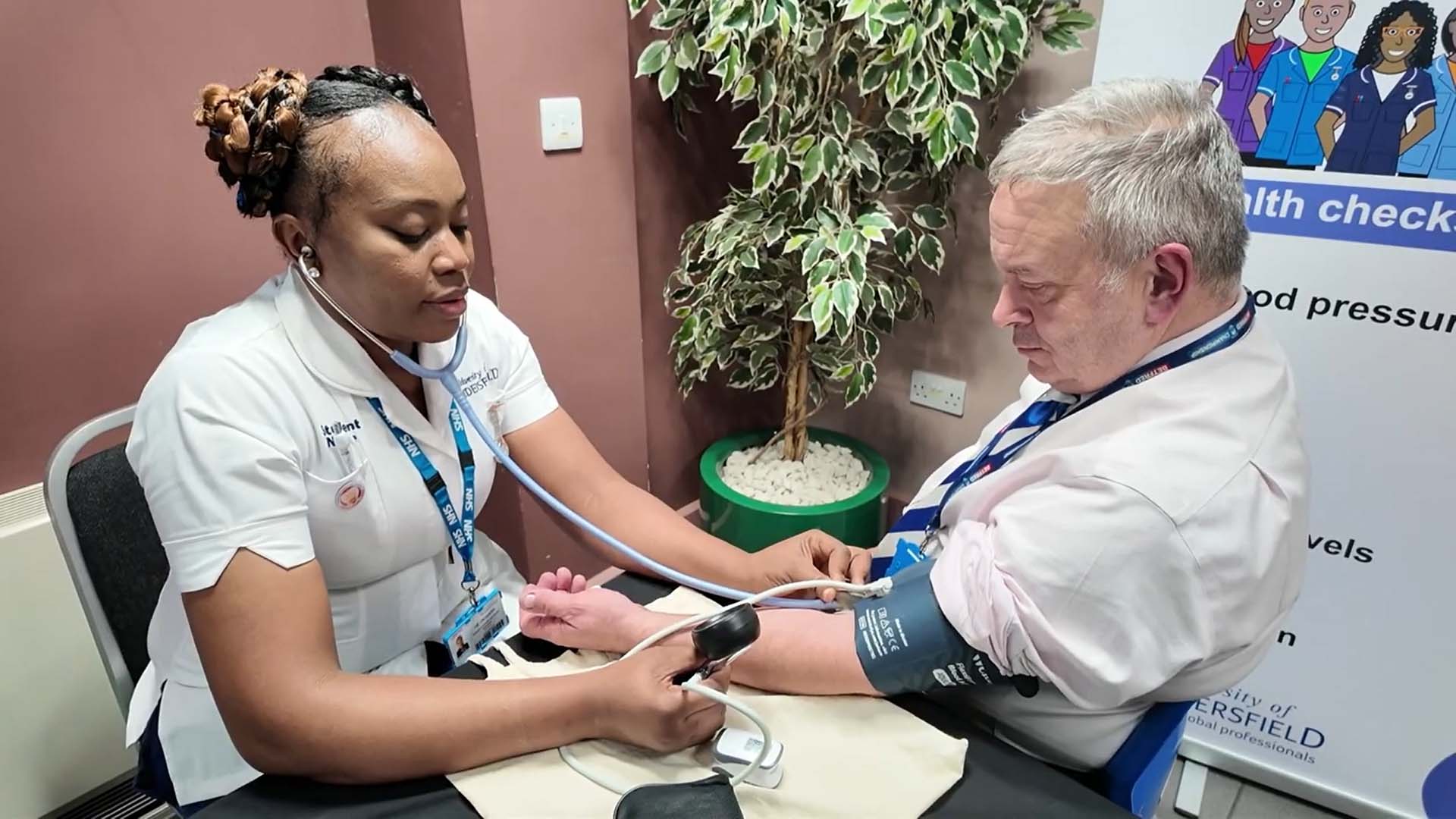 Stephen Whitaker has a blood pressure check with a nursing student