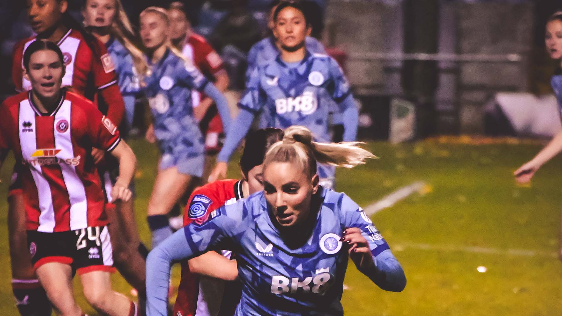 Aston Villa and Sheffield United female players tussle for the ball