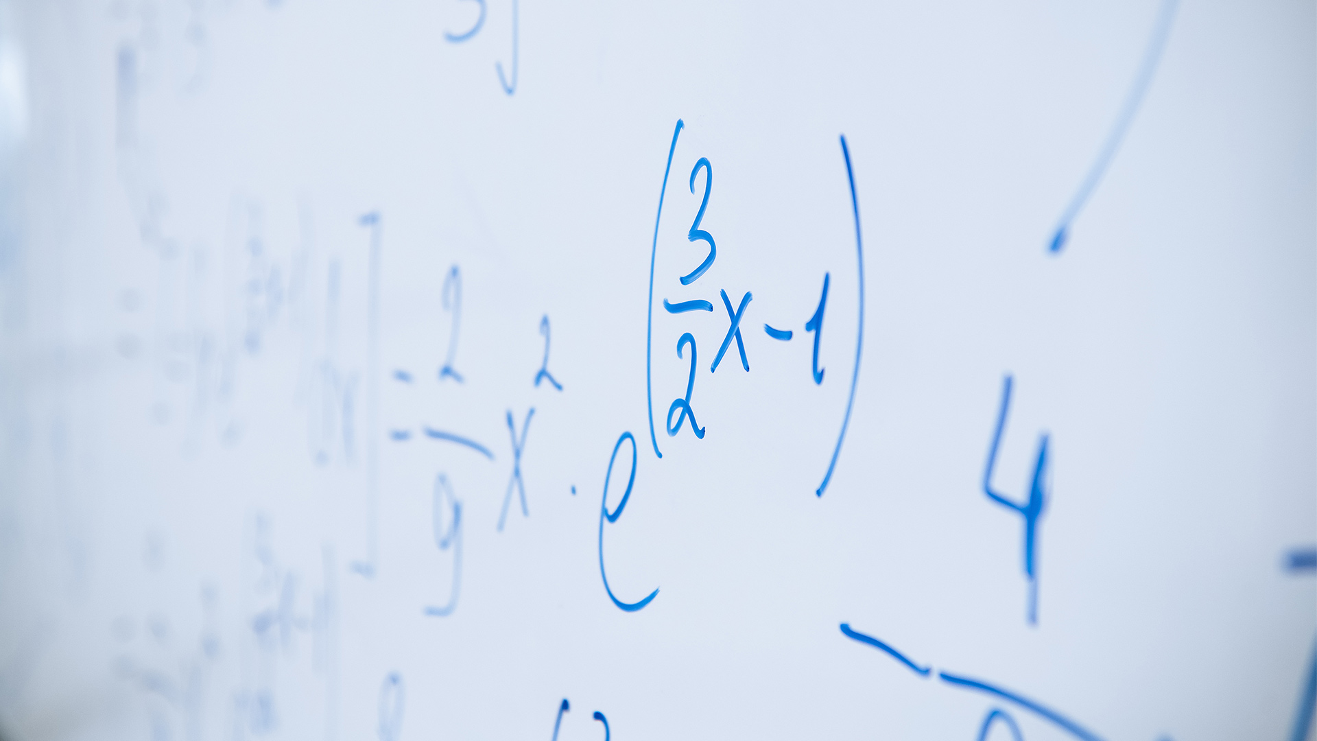 mathematics equations written on a whiteboard