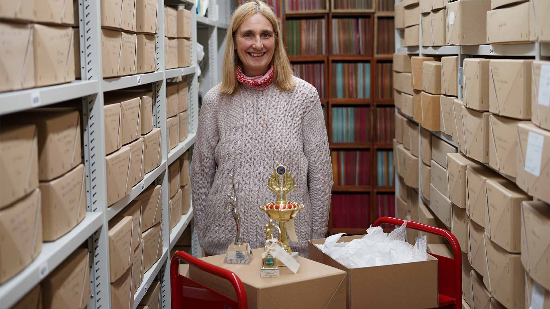 Julia Lee standing inside the Heritage Quay archive