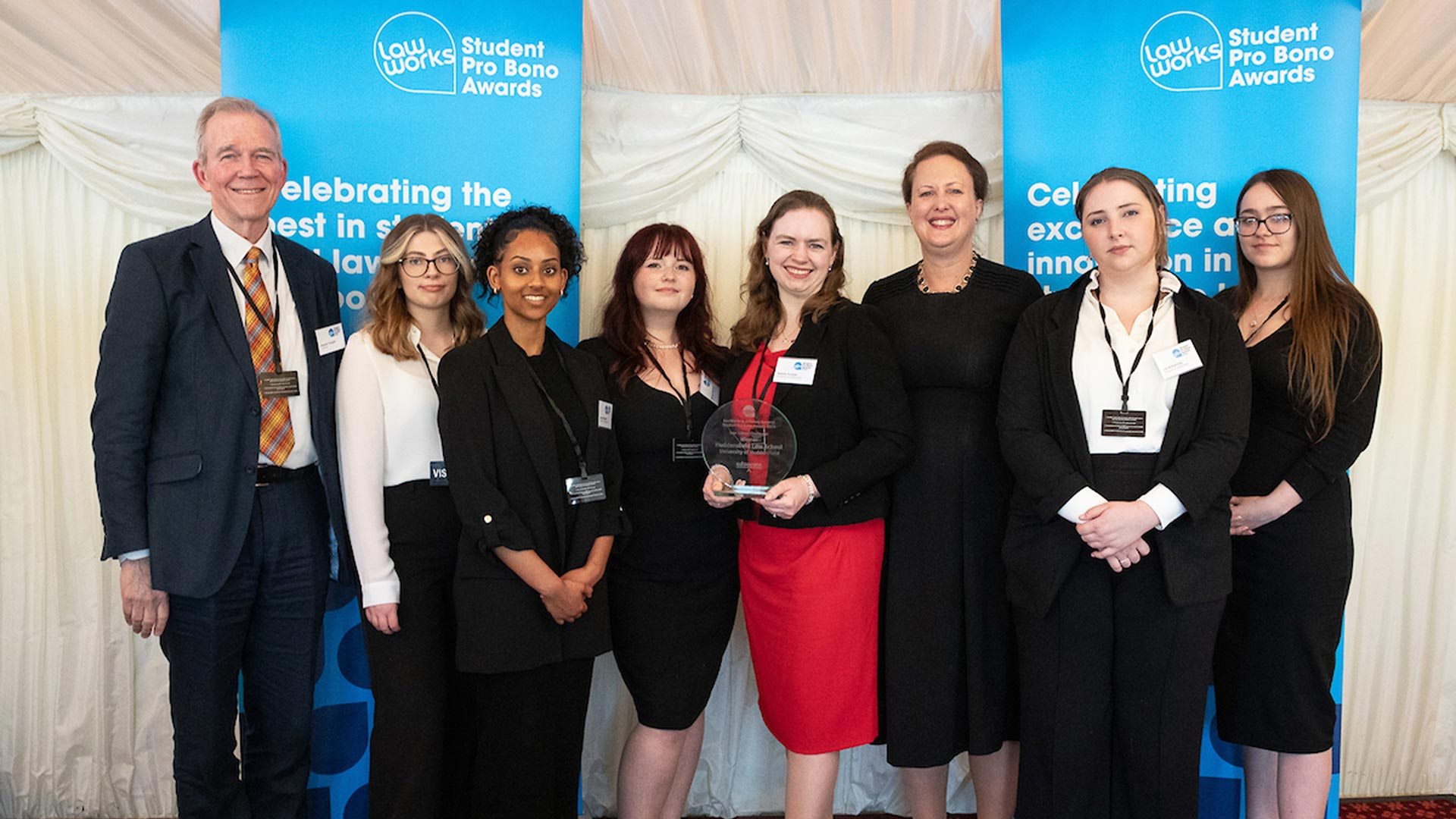 A group of students receiving an award