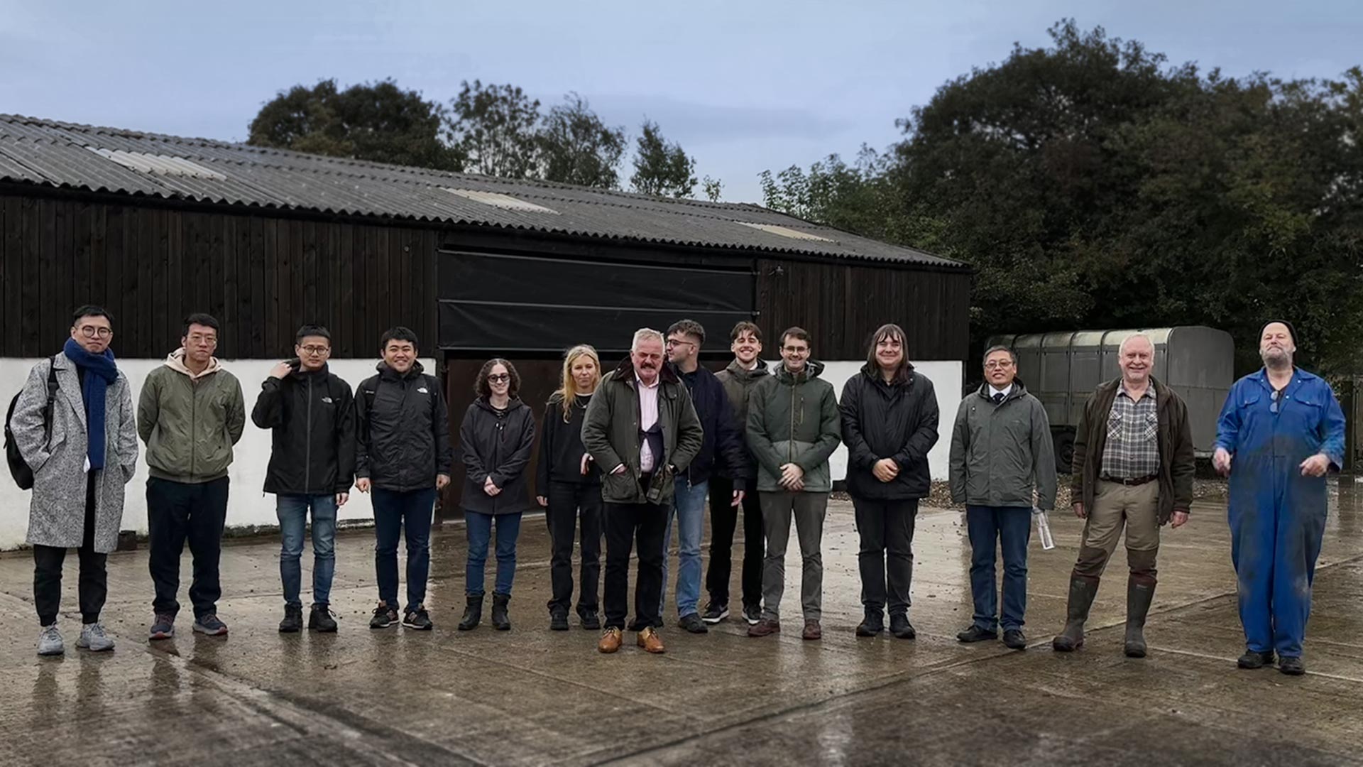 a group of men and women stood outside