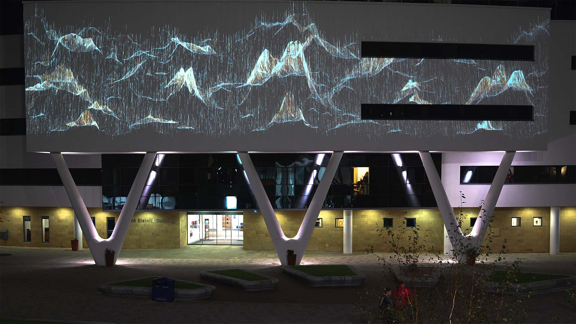 A light display on the Richard Steinitz Building at night