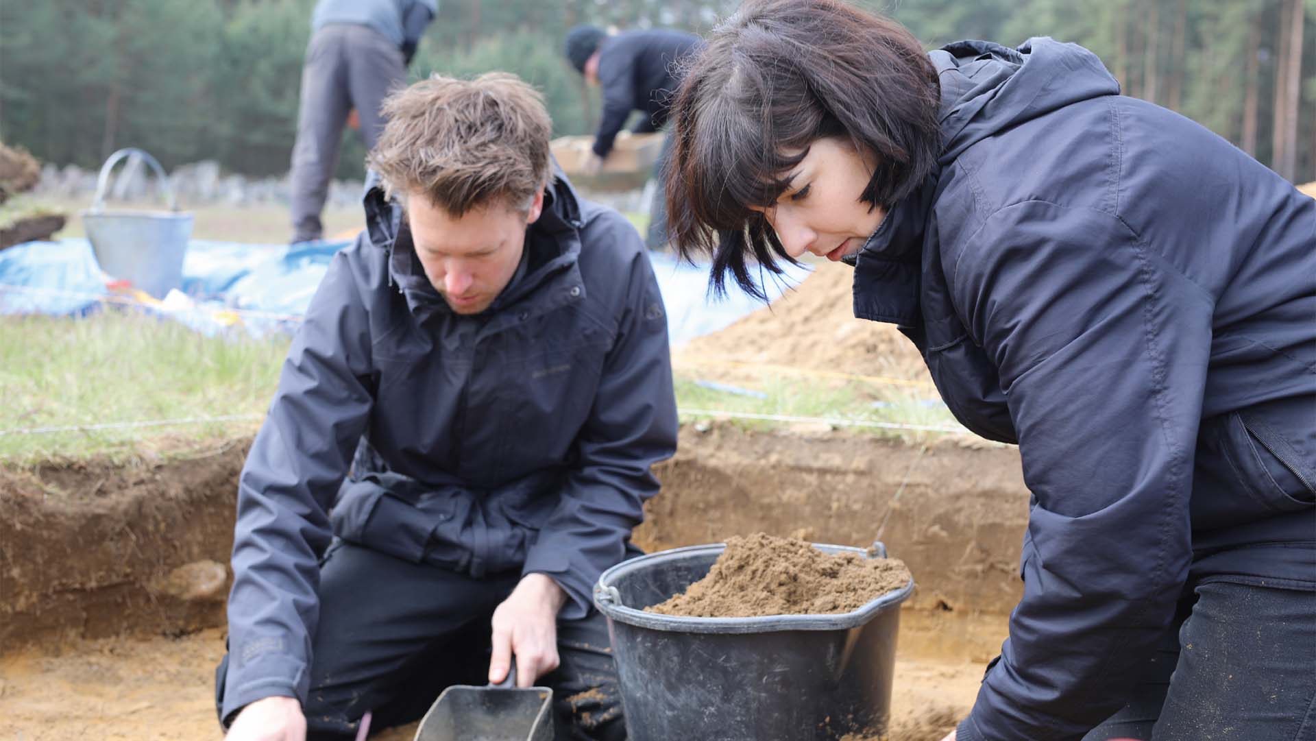 Archaeologists Will Mitchell and  Caroline Sturdy Colls on a dig at Treblinka