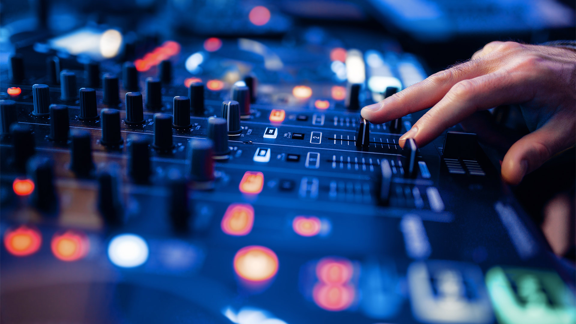 A sound engineer at a mixing desk