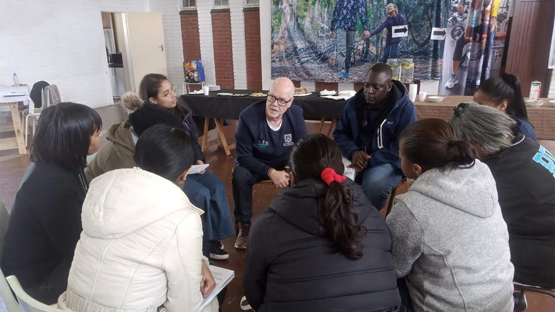 A group of people sitting in a circle