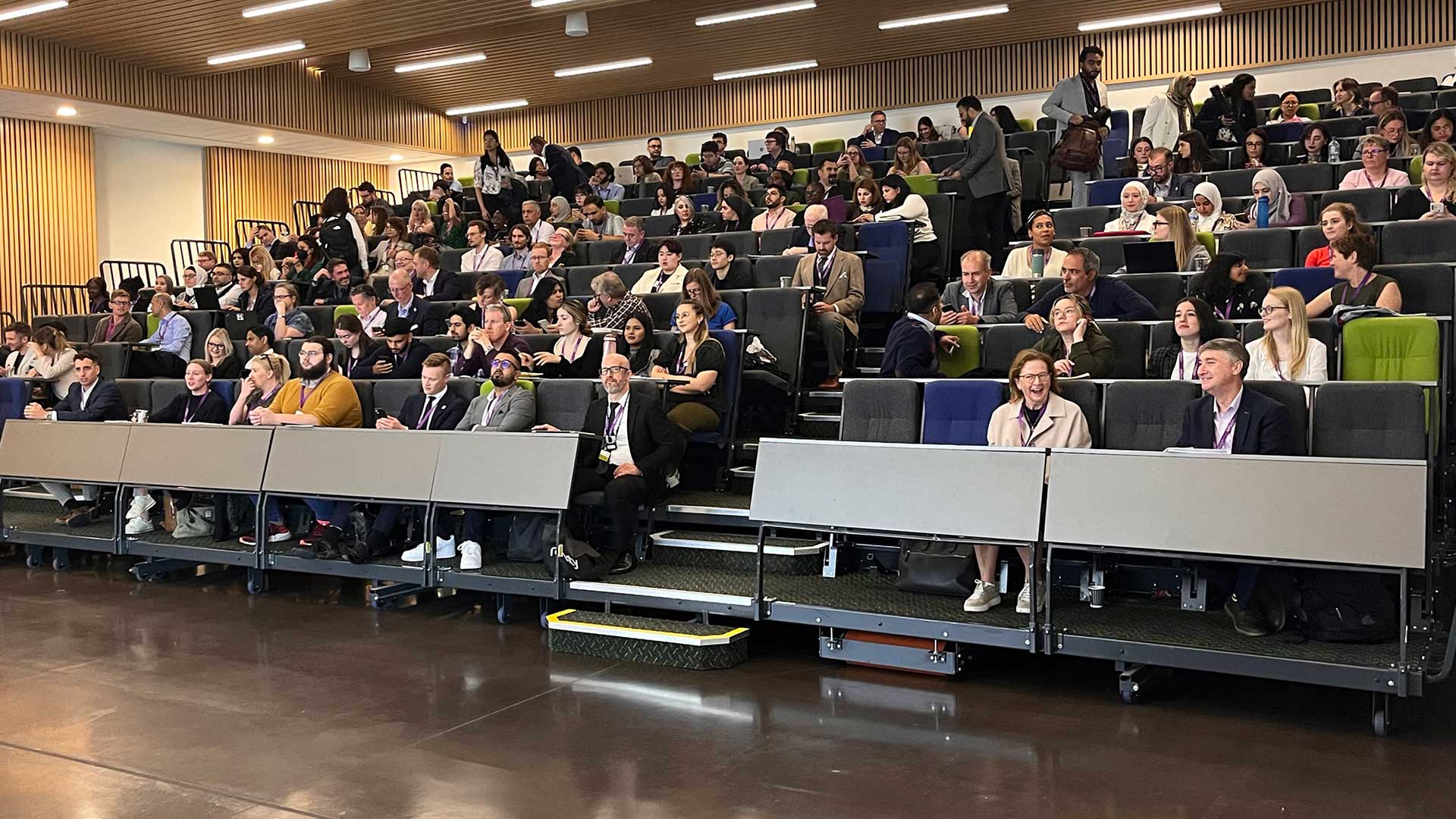 A group of people at a conference