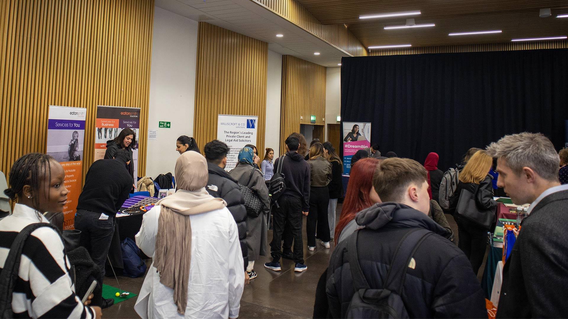 A group of people at a Law careers fair