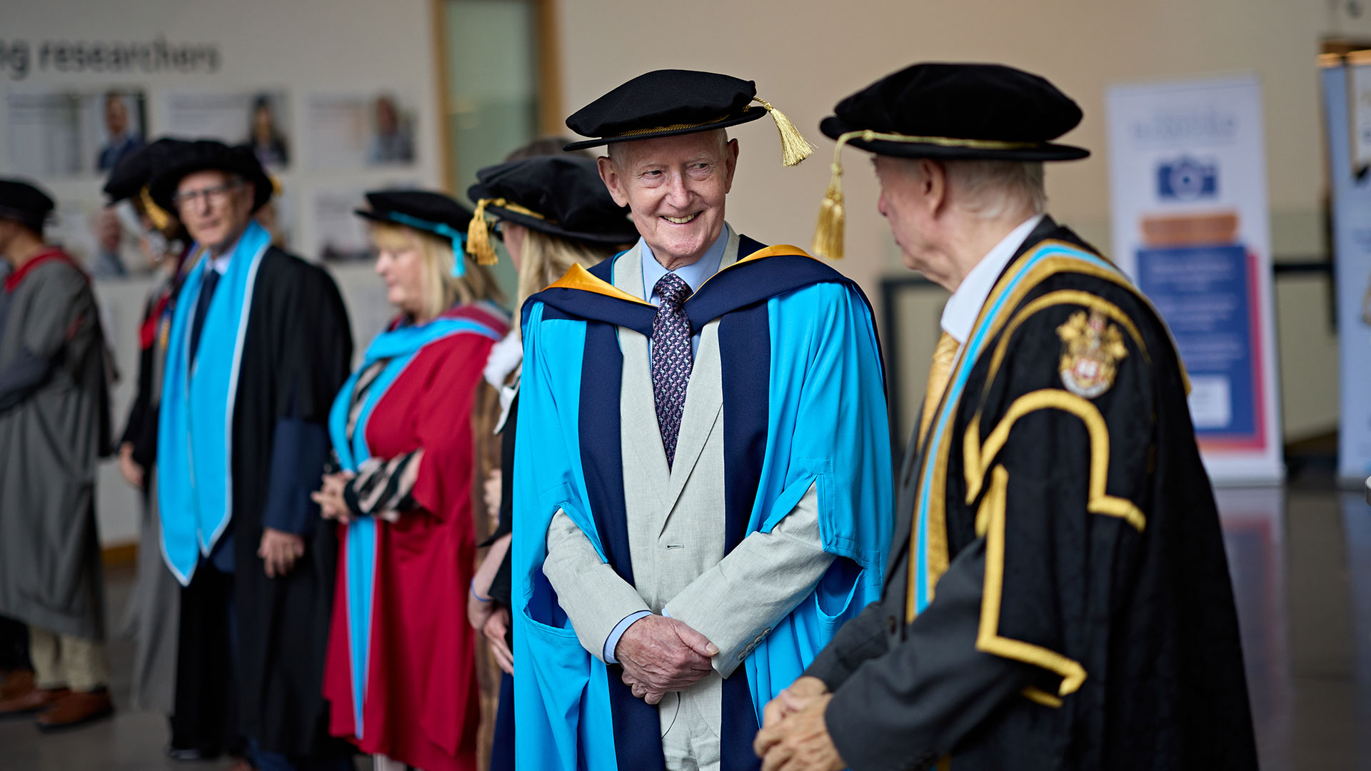 Barry Sheerman on stage receiving an honorary doctorate