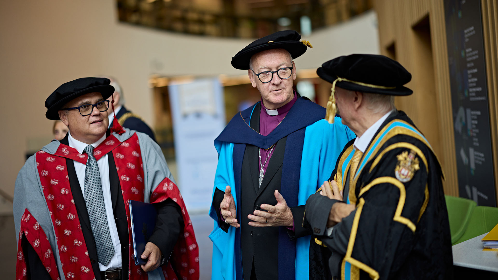 Rev Nick Baines on stage receiving an honorary doctorate