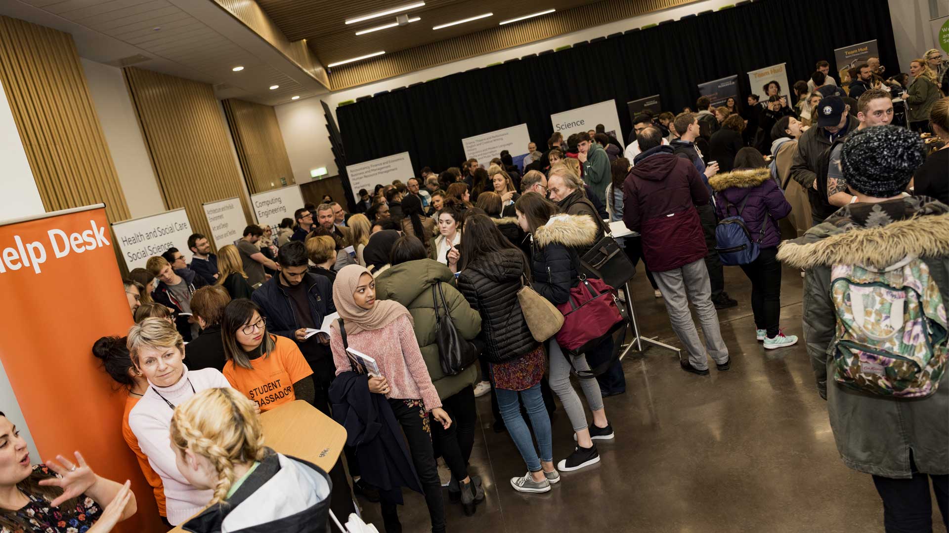 A crowd of people looking around the Postgraduate Study Fair