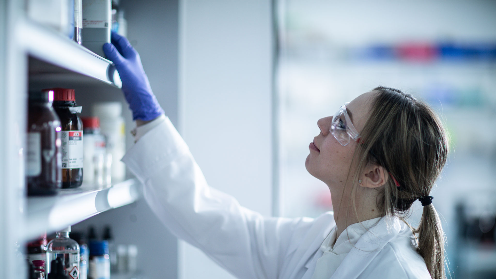 Student pharmacist working in lab with medical samples and equipment