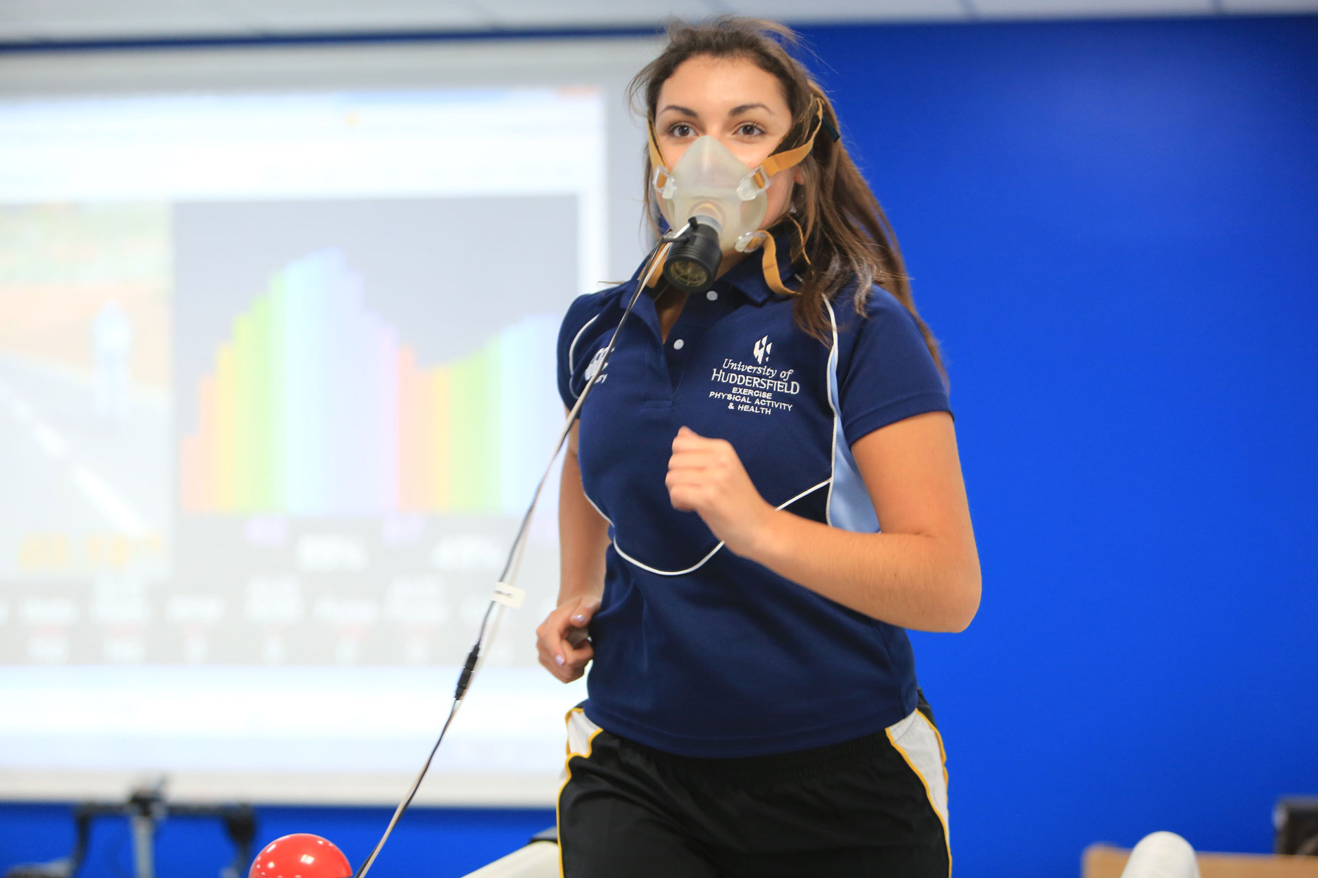 Sport Science image with female student on the treadmill testing out the VO2 max