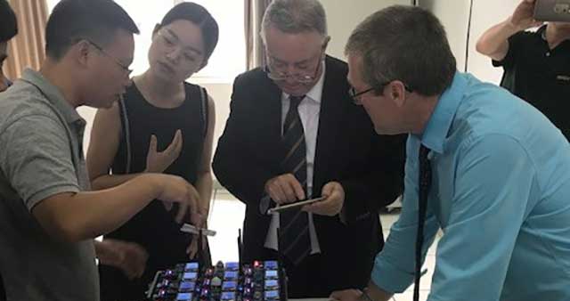 The Vice-Chancellor stood with staff members at Fujian Normal University during a visit.