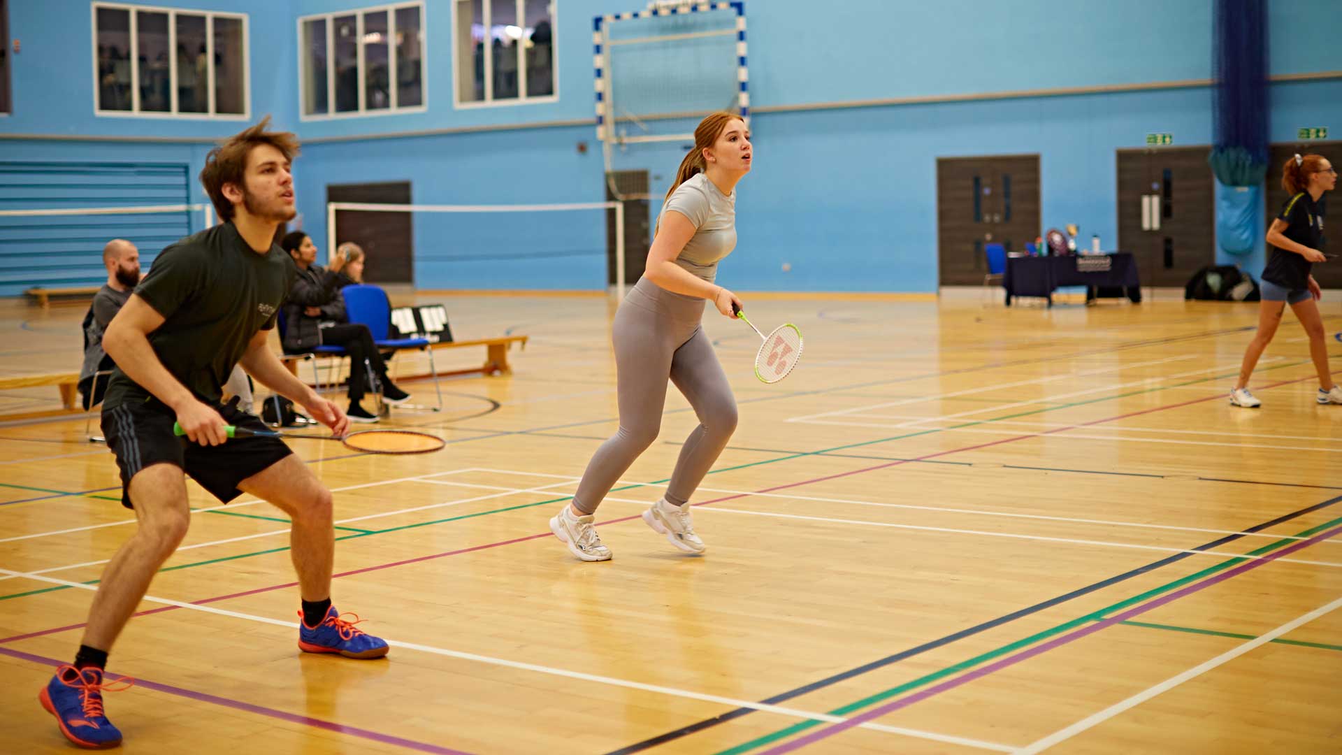 student playing badminton