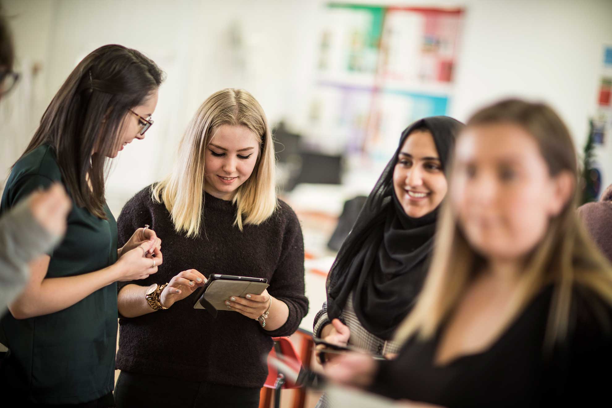 group-of-female-students-with-ipad