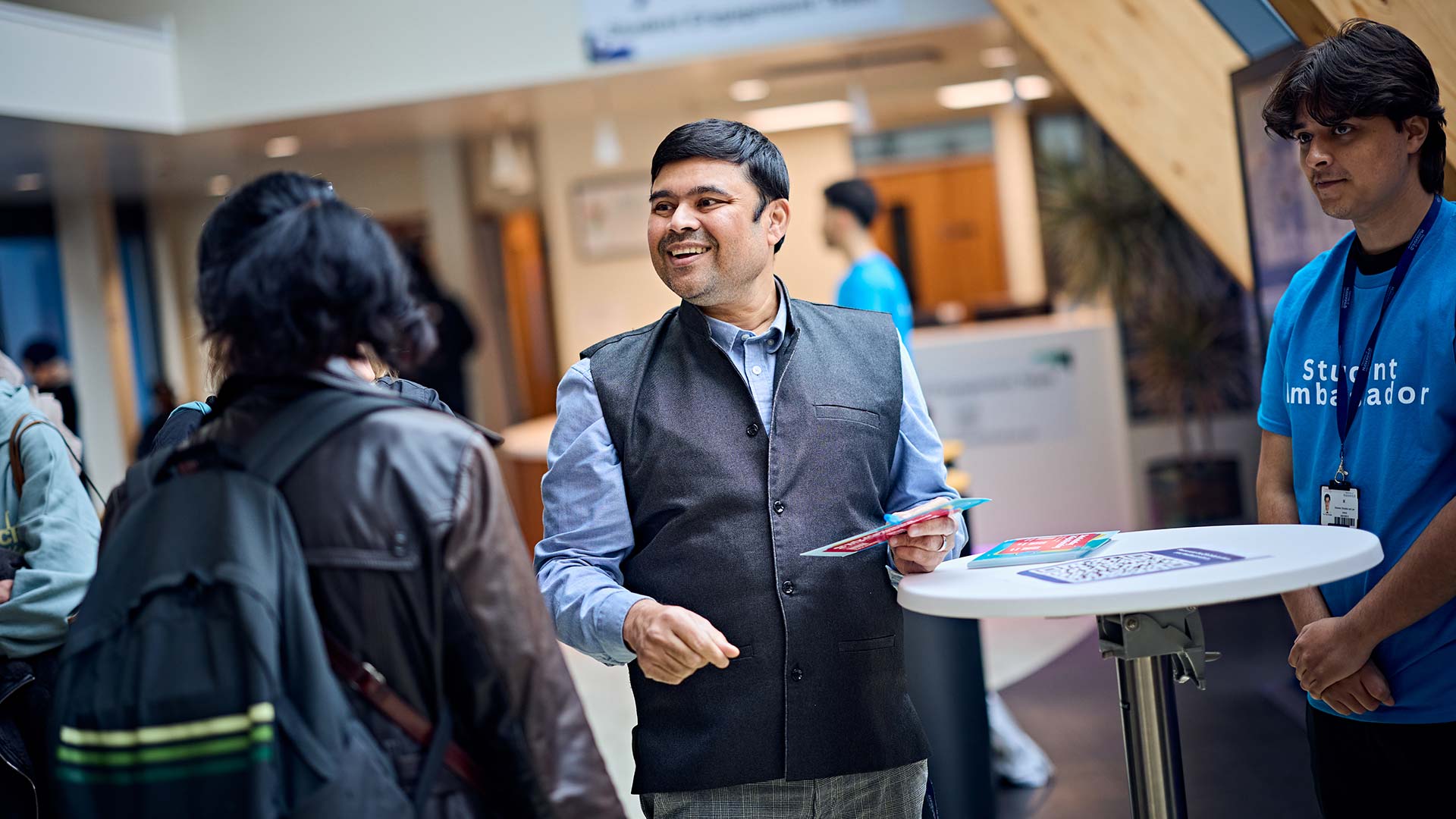 Mohammad with a group of guests at a University Open Day event.